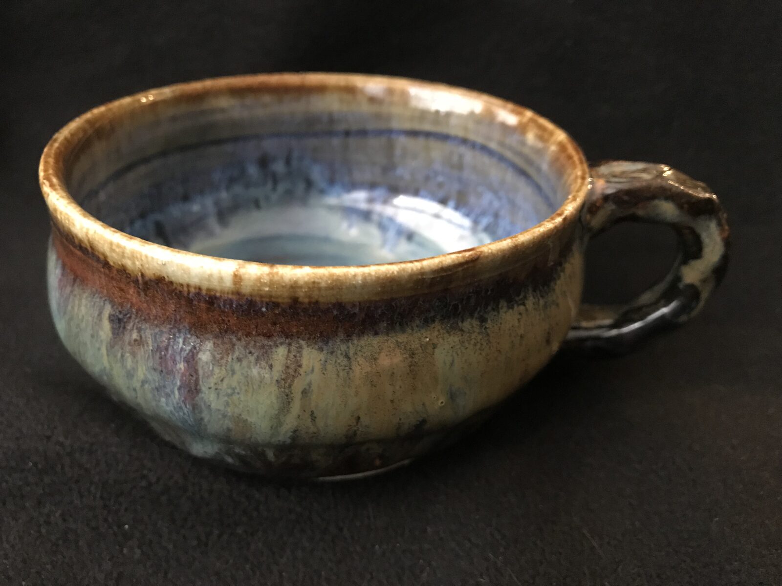 Wide soup mug with handle and earthy multi-toned blue and brown glaze
